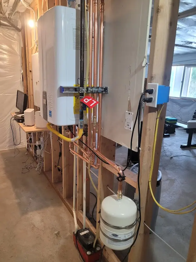 Licensed plumber repairing a kitchen sink in Fulton